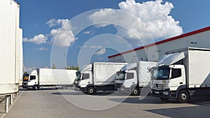 Trucks loading at a depot of a forwarding agency - Transport and logistics in goods trade