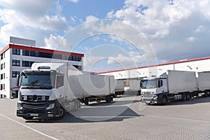 Trucks loading at a depot of a forwarding agency - Transport and logistics in goods trade