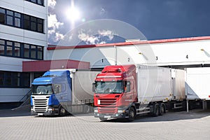 Trucks loading at a depot of a forwarding agency - Transport and logistics in goods trade