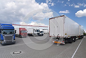 Trucks loading at a depot of a forwarding agency - Transport and logistics in goods trade