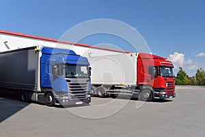 Trucks loading at a depot of a forwarding agency - Transport and logistics in goods trade