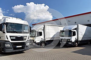 Trucks loading at a depot of a forwarding agency - Transport and logistics in goods trade