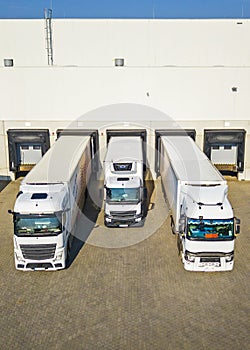 Trucks loading goods in the warehouse