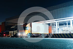 Trucks Loading Goods at Warehouse Port at Night. Trucks Loading Dock Warehouse. Freight Truck Logistic