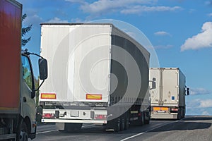 Trucks move on mountain road