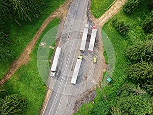 Trucks in a paking in the forest.