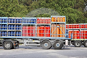 Trucks parked on a street load of propane gas tanks