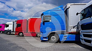 Trucks at parking lot. Delivery Trucks. Cargo Shipping. Lorry. Industry Freight Truck Logistics Cargo Transport Concept.