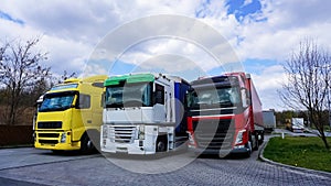 Trucks at parking lot. Delivery Trucks. Cargo Shipping. Lorry. Industry Freight Truck Logistics Cargo Transport Concept.