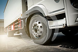 Trucks on The Parking Lot at Warehouse. Truck Wheels Tires. Freight Truck Logistics Transport