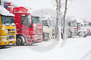 Trucks parking in severe winter storm. Prohibition of traffic in heavy snow