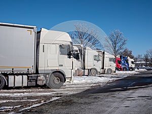 Trucks at a rest area in winter on a German highway