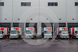 Trucks standing at loading docks for shipping from warehouse