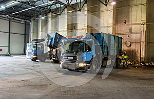 Trucks unloading garbage