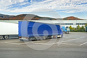 Trucks are waiting for loading at the warehouse, delivery by road