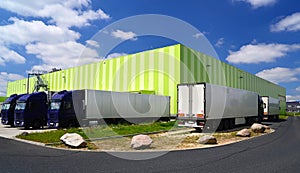 Trucks at the warehouse of a forwarding agency are loaded with g