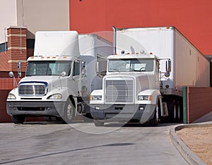 Trucks at warehouse loading dock