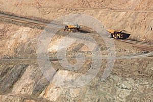 Trucks working in the Super Pit - a gold mine in Kalgoorlie, Western Australia