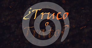 Truco o Trato (Trick or Treat) Spanish text dissolving into dust from bottom photo