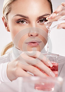 True beauty comes from within and is seen outwardly. Studio shot of young woman making a potion against a white