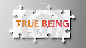 True being complex like a puzzle - pictured as word True being on a puzzle pieces to show that True being can be difficult and