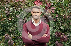 true confidence. male fall season fashion. handsome guy on autumn leaves background. male beauty concept. confident