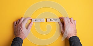 True and False sign on wooden pegs