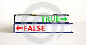 True or false symbol. Concept word True or False on beautiful books. Beautiful white table white background. Business and true or