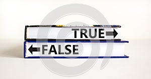 True or false symbol. Concept word True or False on beautiful books. Beautiful white table white background. Business and true or