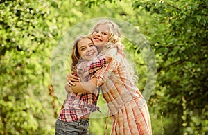 True friendship. Girls smiling happy faces hug each other. Girls children best friends hug. Sisterhood love and support