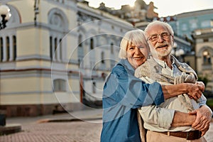 True love has no expiration date. Portrait of cheerful senior couple in casual clothing embracing each other and looking
