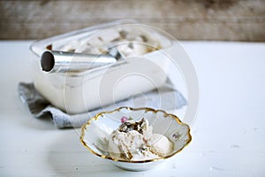 Truffle ice cream scooped in a rustic bowl, delicacy