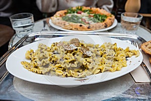 Truffle pasta. Delicious Italian fresh pasta with truffle pieces on the top, mascarpone and olive oil photo