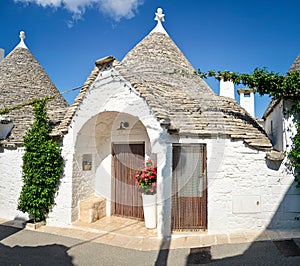 Trulli of Alberobello, Puglia, Italy: Typical houses built with dry stone walls and conical roofs. In a beautiful sunny day.