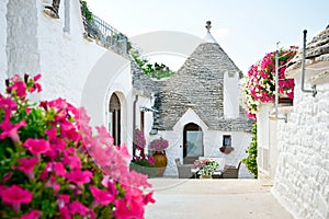 Trulli of Alberobello, Puglia, Italy: Typical houses built with dry stone walls and conical roofs. In a beautiful sunny day.