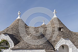 Trulli roofs against a blue sky. Alberobello, Apulia, Italy