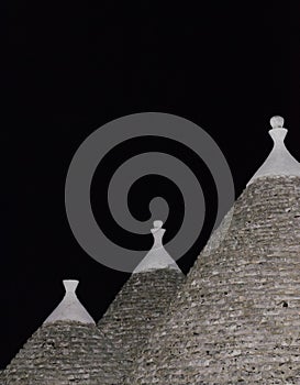 Trulli roofs in the night. Three trulli at cisternino in apulia Italy