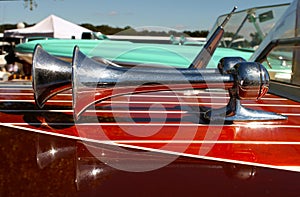 Trumpet Horns With Refletion on Wooden retro Speed Boat Detail at marina boat show photo