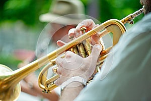 Trumpet player performs street performances with his group