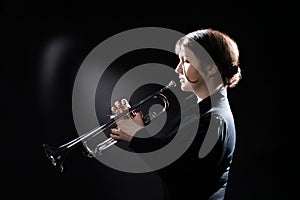 Trumpet player. Woman trumpeter photo