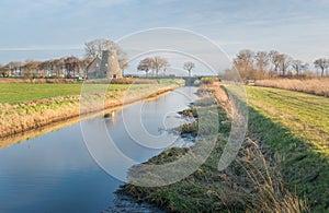 Truncated windmill in a Dutch rural landscape photo