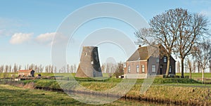 Truncated windmill in an rural landscape