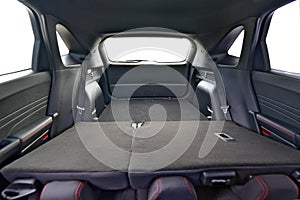 Trunk of car with rear seats folded, inside view