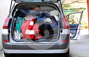 Trunk of the car very overloaded with bags and luggage