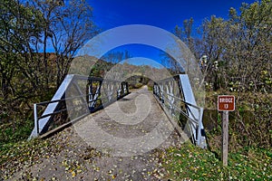 Truss bridge during Fall colors over the Kickapoo River near Lafarge at the Kickapoo Valley reserve