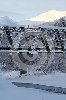 Truss bridge over frozen river