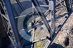 Truss bridge with rivets high above the deep gorge