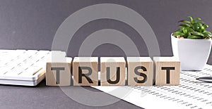 TRUST acronym, business concept background with chart ,pen