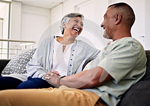 Trust, happiness and laughing elderly couple relax, talk and enjoy funny conversation, care or humour in Mexico home