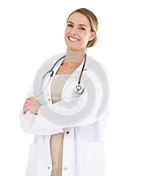 Trust me with your health. A beautiful female doctor smiling at the camera with her arms folded.